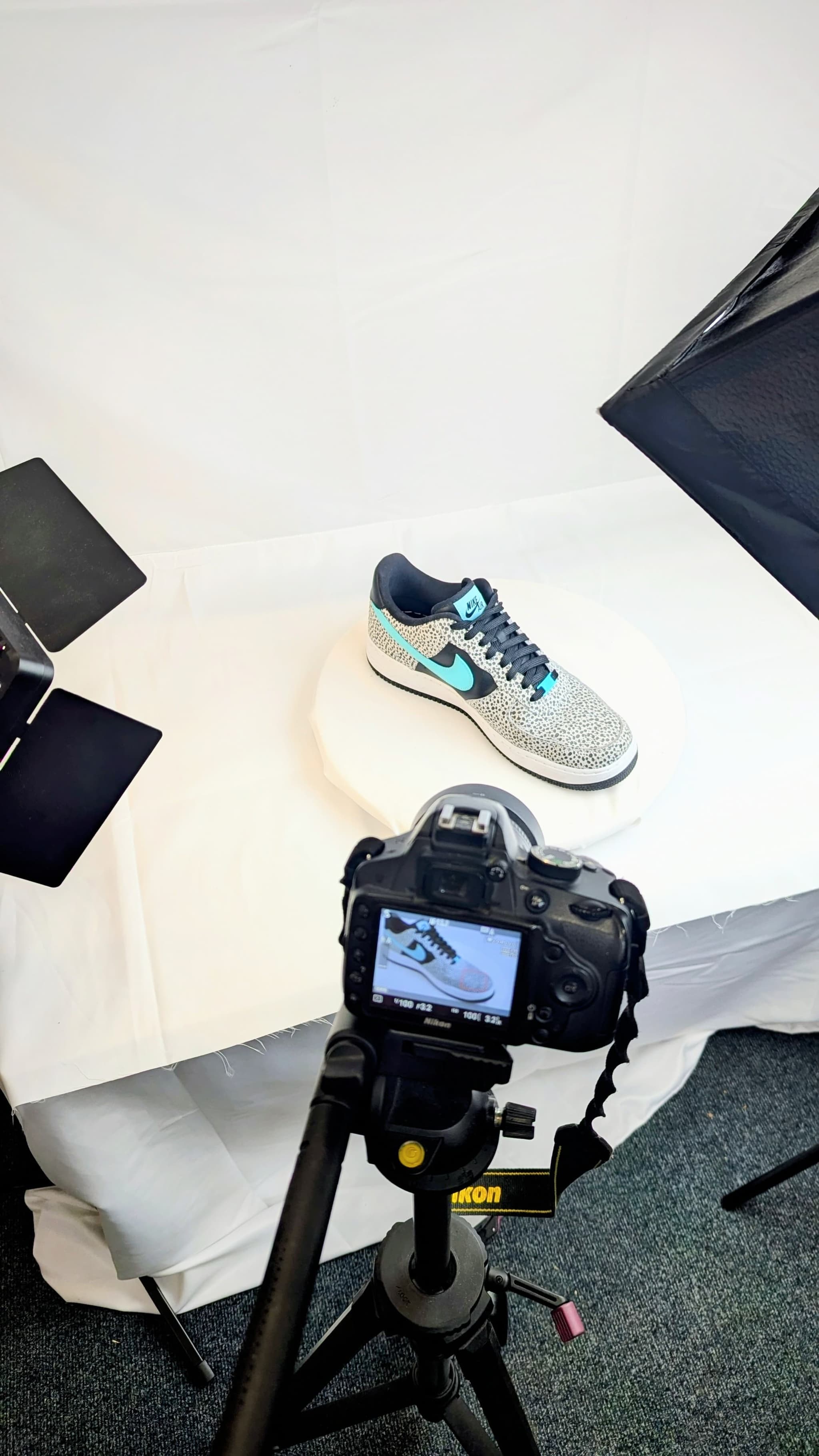 Fashion sneaker close-up 3D scan showing leather texture, stitching details, and branding captured with turntable photogrammetry