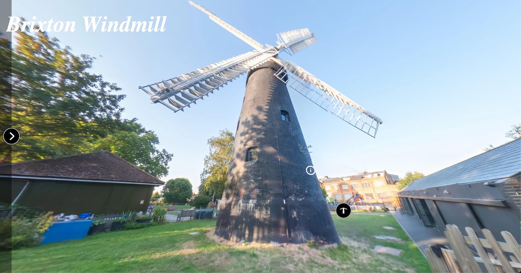 Close-up aerial view showing weatherboarding detail and traditional windmill sails